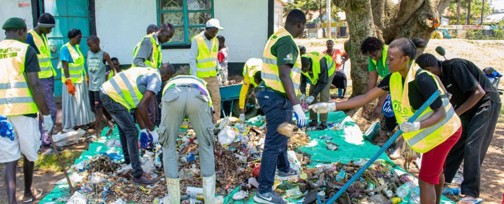 Picture of M taka agents collecting waste